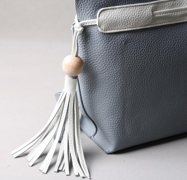 2016 summer new Korean fashion spell color tassel leather handbag drawstring shoulder bag packet header layer of skin