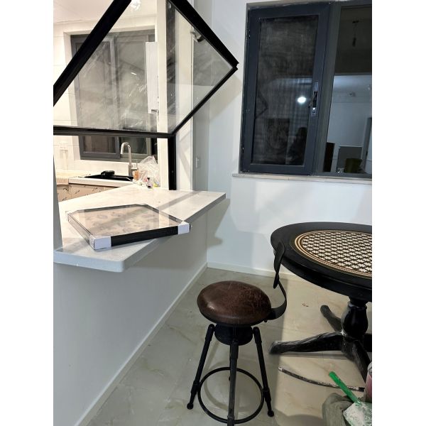 Wide-Format Folding Window Configuration Framing Mountain Vistas and Urban Skyline Views with Minimal Framework