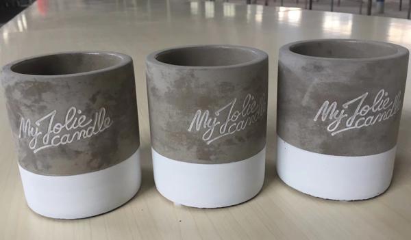 Decorative & garden scented candle with oud fragrance and the container is made from cement material