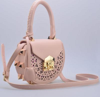 2016 Korean version of the new shoulder bag female fashion rivets hollow pattern portable diagonal package