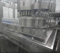 Equipo de tapado rotativo de alta velocidad para líneas de producción de agua embotellada de 48,000 BPH
