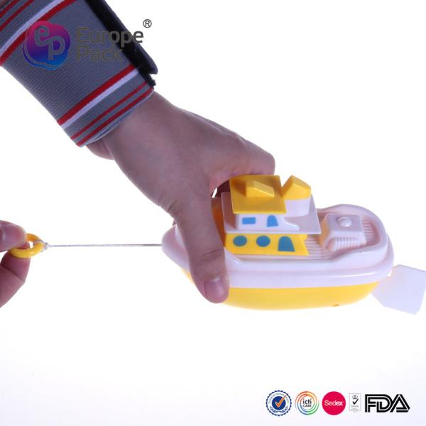 Plastic toy boat  pull line drives the boat  sailing
