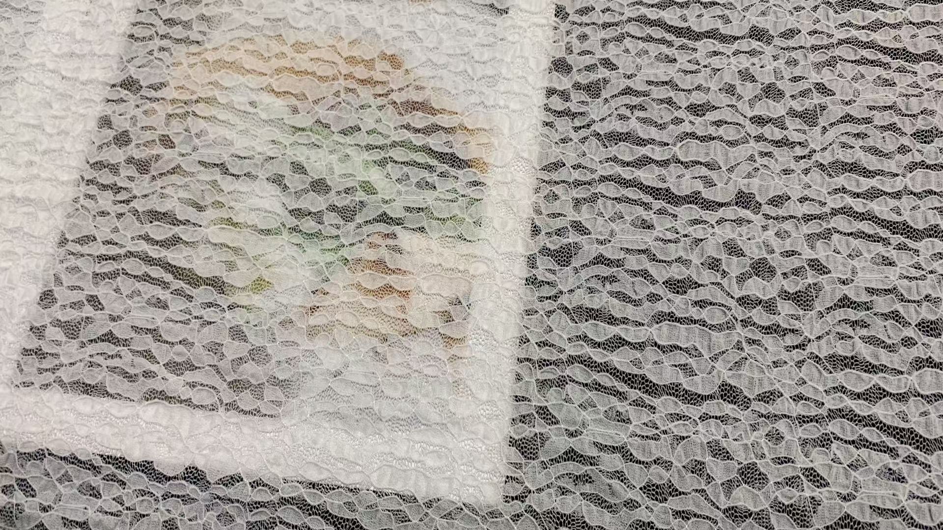 Stretchy Lace Fabric with Irregular Leaf-shaped Motifs and Fine Mesh Base for Soft Elastic Feel in Dress and Ladies Apparel