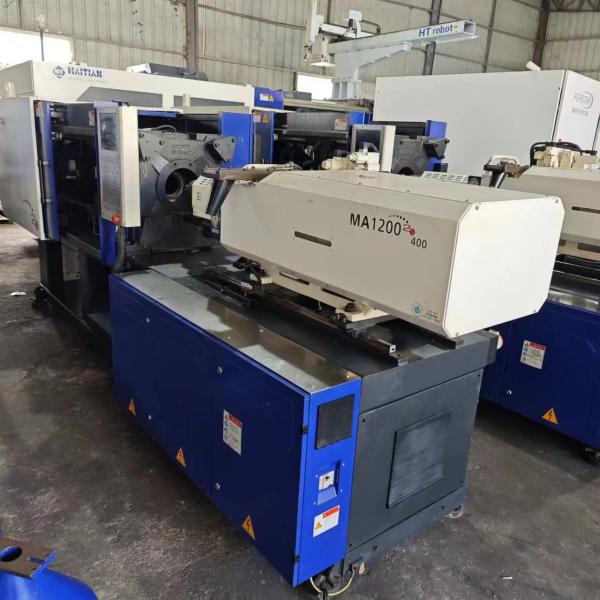 Máquina de moldeo por inyección de servomotor MA1200IIS/400 usada 1200KN con volumen de inyección PS de 214cm3