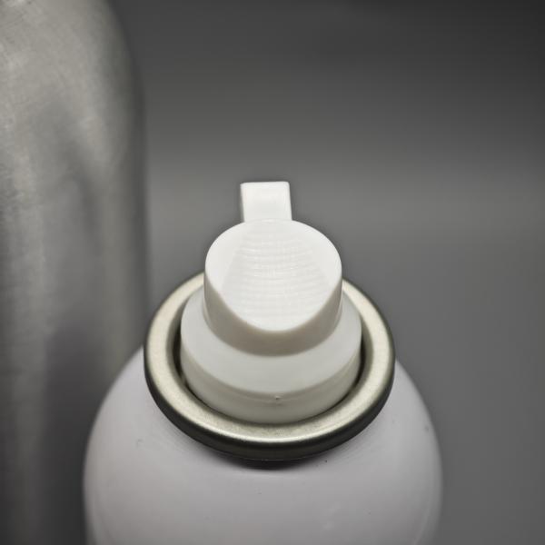 Compact Shaving foam valve for travel-sized grooming kits with leak-proof seal and easy operation