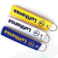 Un porte-clés brodé personnalisé par Lufthansa. Personnalisation à 10 caractères et polyester certifié OEKO-TEX. Expédition mondiale (DHL/EMS).