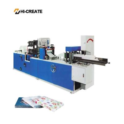 Máquina imprimindo automática com os guardanapo de papel gravados do guardanapo