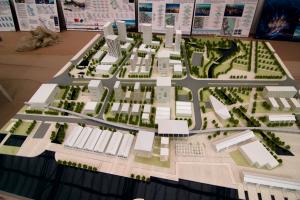 Architectural model urban block layout with mixed-use buildings, detailed green