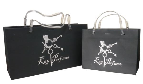 Stamped Logo Brown Matte Coated Paper Carrier Bag Silvery Embossed Logo Twist Rope Handle 210g