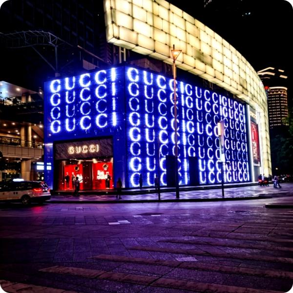 Outdoor landscape lighting on the exterior walls of the building colored LED grid screen
