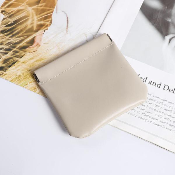Self-tightening shrapnel storage bag Phone headphone cable Bluetooth earbud bundle pocket