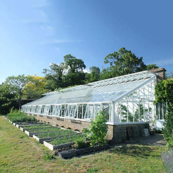 Système solaire monté par toit de serre chaude pour des terres cultivables
