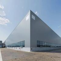 Entrepôt en métal préfabriqué écologique Construction de cadre en acier préfabriqué sur mesure