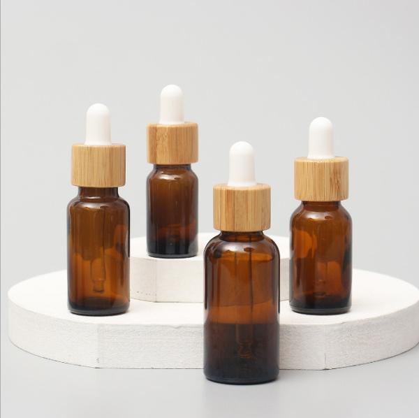 Recipientes cosméticos do vidro de vidro lustroso do tampão da madeira da garrafa do conta-gotas de Amber Color Bamboo Essential Oil