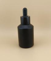 Flasca de vidrio negro de diseño delicado para la esencia facial
