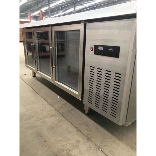 Stainless steel commercial refrigerator workbench in the back kitchen of hotel restaurant