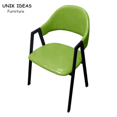 Um quadro dado forma do metal que janta cadeiras com cinza amarelo verde do ferro minimalista dos braços