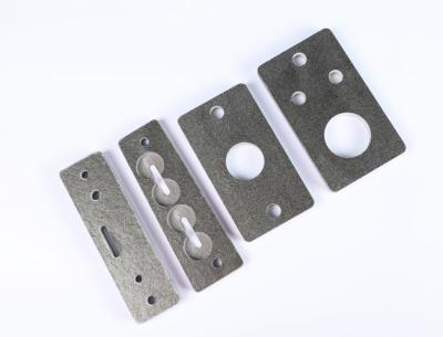 Pièces d'isolation thermique à base de mica destinées aux fours à fréquence moyenne