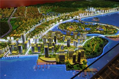 As rendições colorem o modelo diminuto da cidade, modelo pequeno da cidade do uso da exposição