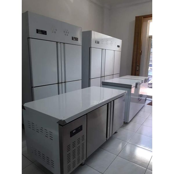 Stainless steel commercial refrigerator workbench in the back kitchen of hotel restaurant