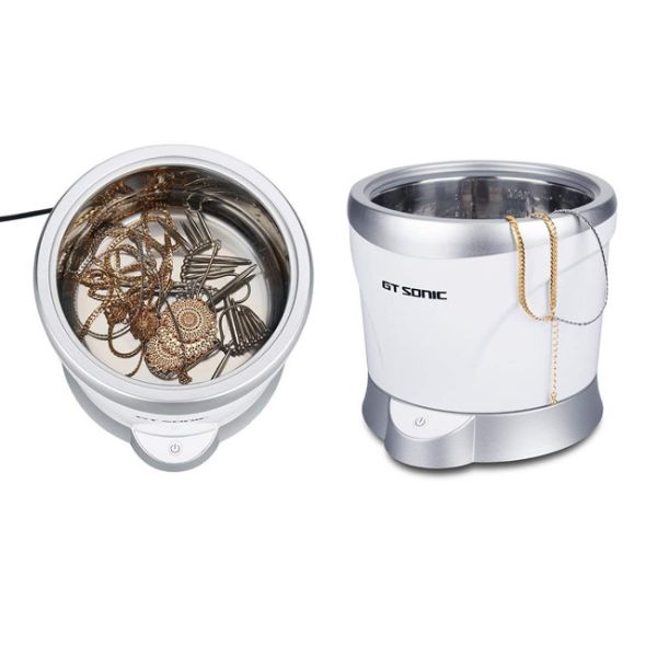 Un limpiador ultrasónico del hogar del botón con forma redonda del tanque desmontable