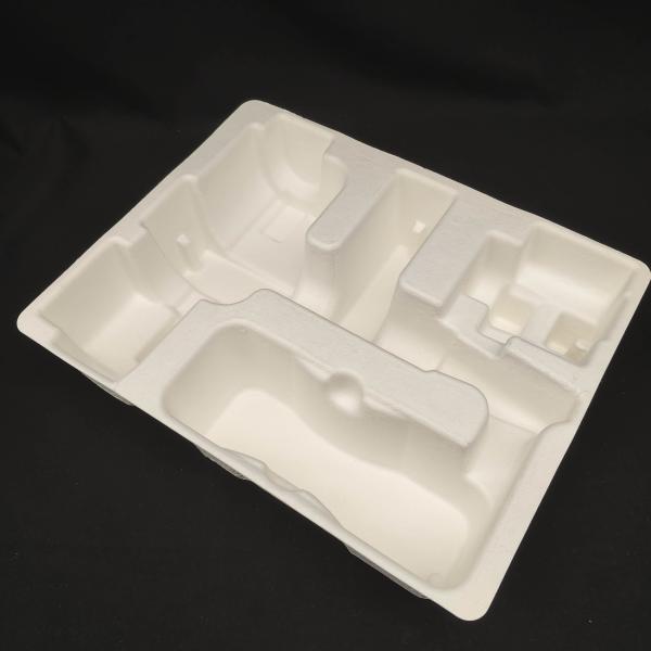 OEM manufacturers customize pulp molded packaging bases for small household appliance fascia guns. These are made of white plant fibers through dry pressing.