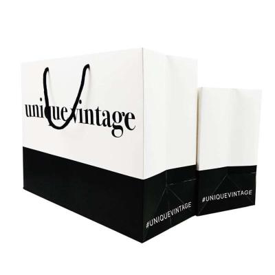 Logotipo personalizado Vestuário Compras Embalagem de presente Saco de papel com corda de tração e revestimento UV