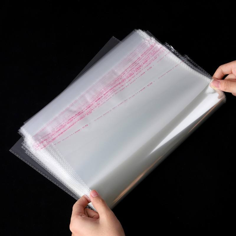 Wholesale custom transparent self-sealing adhesive Opp plastic bags for candies, clothing, books and notebooks