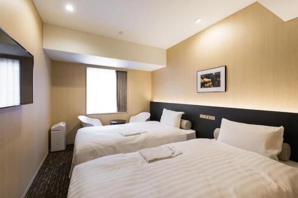 Auckland hotel inn resort Laminate wood headboard bed with in wall cabinet and TV panel stand