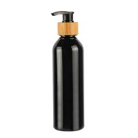 Bouteille de lotion cosmétique pour épaule ronde noire Bouteille en PET de bambou 180 ml 200 ml 250 ml 300 ml
