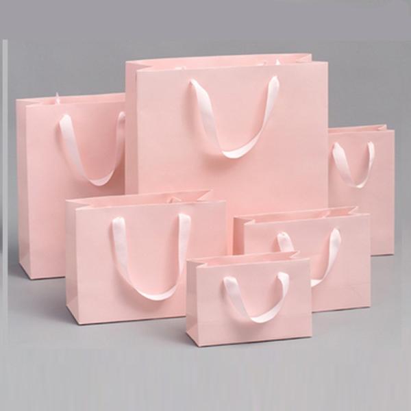 Sac en carton rose clair et blanc pur épaissi, sac d'emballage de vêtements, sac cadeau, sac à main souvenir