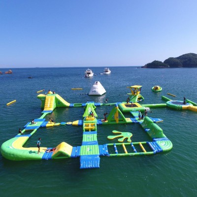 Modular Inflatable Water Park with Custom Floating Obstacle Course Slides Climbing Elements And Connected Play Platforms for Lake Resort Beach And Large Outdoor Aqua Recreation Projects