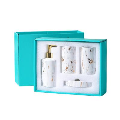 Accessoires en céramique adaptés aux besoins du client de salle de bains réglés avec le support de brosse à dents de porte-savon