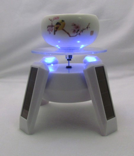 Rotary solar china display holder